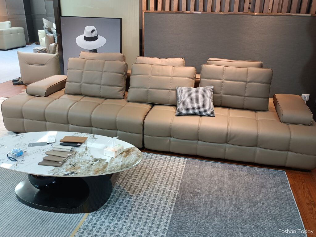 Light brown genuine leather sofa with pillow cushions