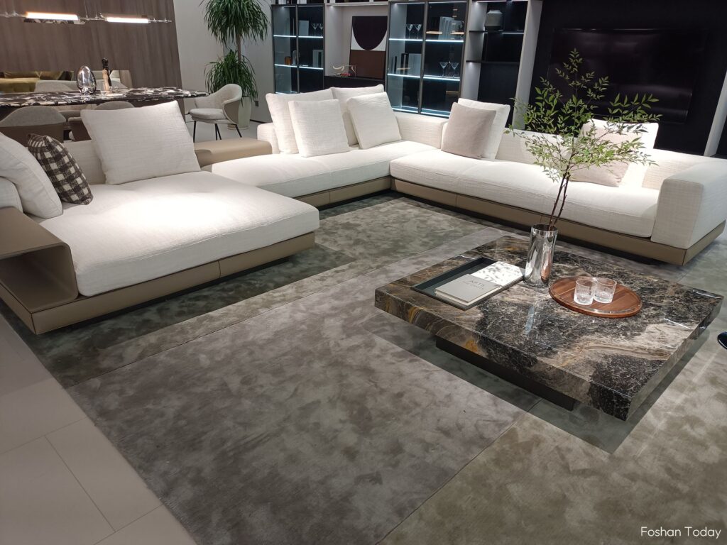 White super-soft sofa with white cushions and marble coffee table