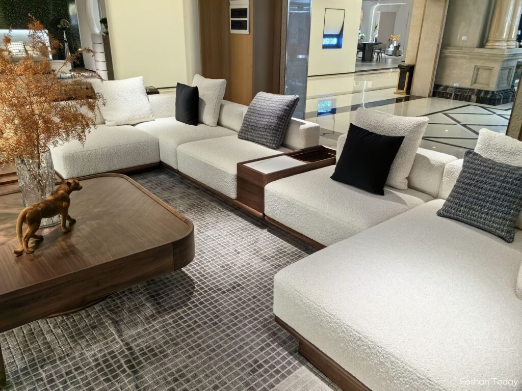 L-shaped white sofa and wooden coffee table